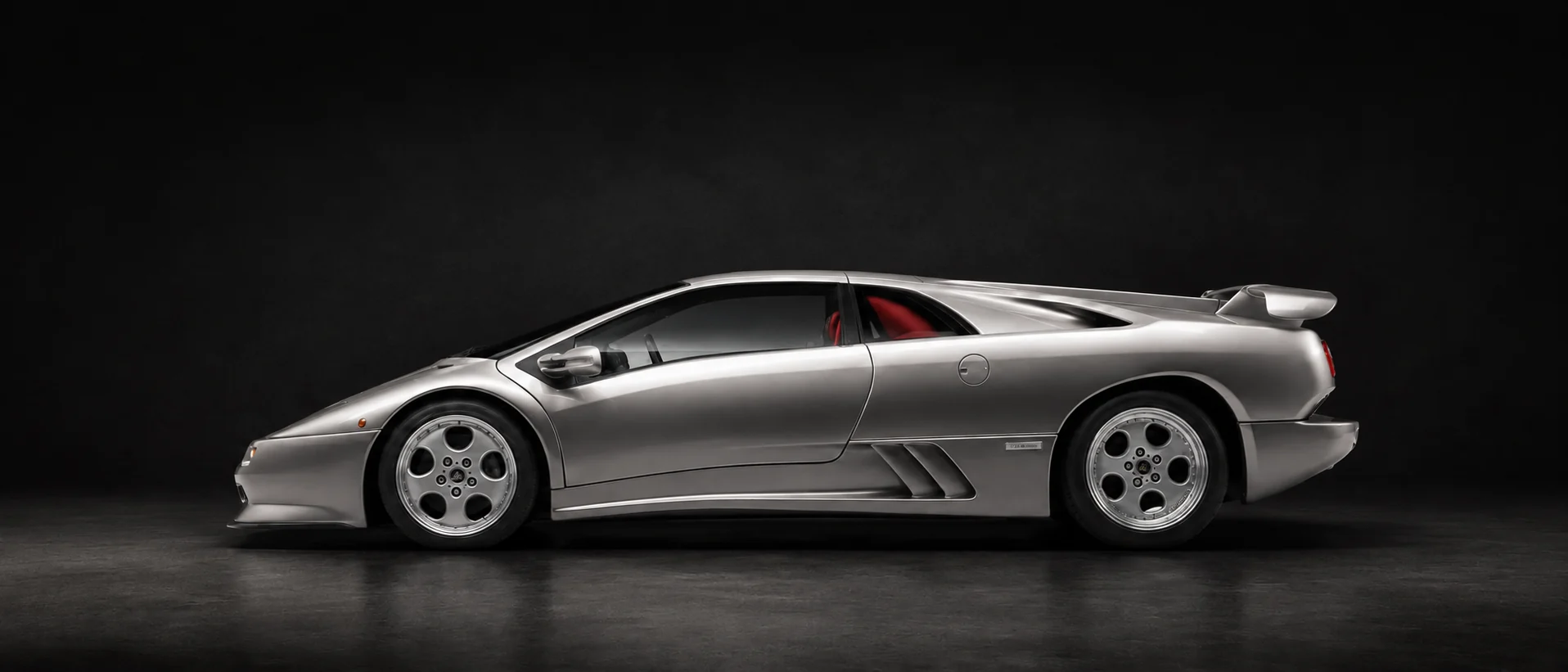 Lamborghini Diablo SE30 in profile, showing the wedge silhouette and full-width rear wing