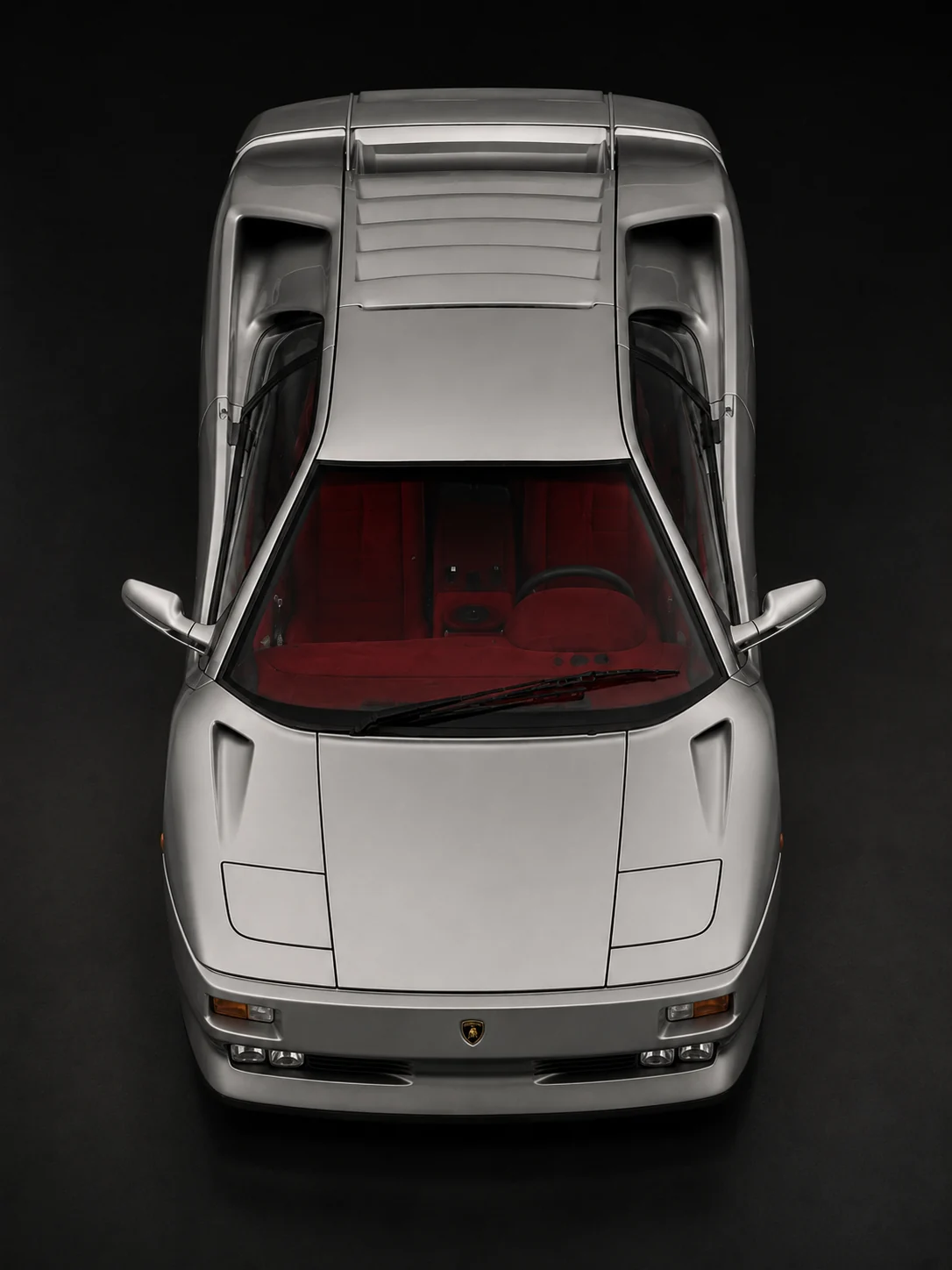 Overhead view of a silver Lamborghini Diablo SE30 showing the roof, engine cover and rear wing